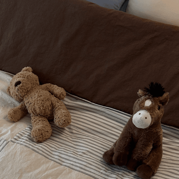 High-density cotton bedding set in a sunlit nursery